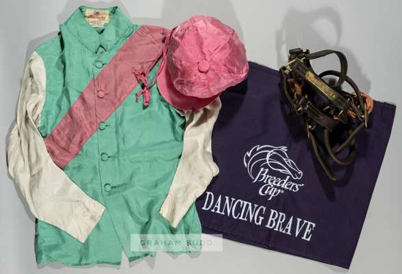 Dancing Brave winning race worn silks from the 1986 Prix de l'Arc de Triomphe at Longchamp,
 the green jacket with pink seam running across the body a