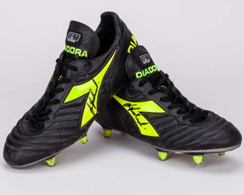 Les Ferdinand a pair of black and yellow Diadora match worn football boots, 2003