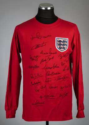 Red England Bobby Moore No.6 1966 World Cup Final retro jersey signed by 21 members of Alf Ramsey's squad and offered with a separate Bobby Moore auto