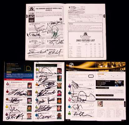Three autographed A.P. McCoy career milestone racecards, all signed by McCoy to the front cover and additionally all the other competing jockeys as we