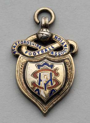 Silver gilt & enamel Staffordshire FA Senior Cup winners medal awarded to Stan Lynn of Aston Villa in season 1953-54,
 inscribed with competition deta