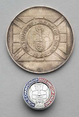 World Cup 1966 white metal and enamel lapel badge and a white metal medallion, 
 both featuring the World Cup logo and each cased, (2)