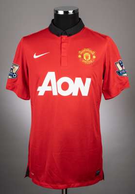 Federico Macheda red & black No.27 Manchester United short-sleeved jersey, 2013-14, 
 with button-up collar and embroidered cloth badge, the reverse l
