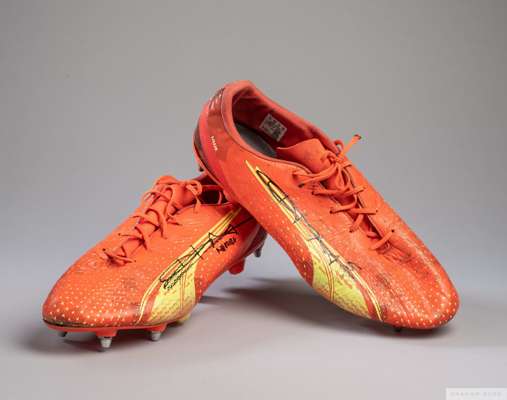 Harry Maguire orange Puma football boots, 
 size 13, match worn with England badge on the back, PIPER printed on the left boot and LILLIE printed on t