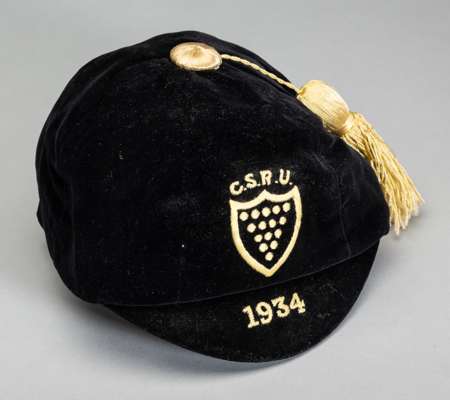 Cornwall Schools' rugby representative cap 1934,
 black velvet cap with yellow tassel, embroidered with C.S.R.U. crest and 1934, bears name label on i