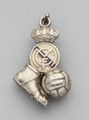 A silvered and enamel Real Madrid pendant in the form of a football boot with ball and club crest with a crown and suspension ring,
  not silver, 3.5 