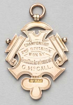Scottish Football League second division championship winner's medal awarded to Hamilton Academical's G. McCall, 1903-04,
 obverse with red enamelled 