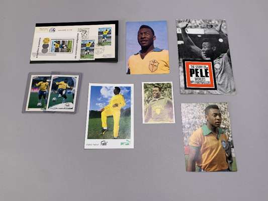 A collection of Pele related ephemera including first day covers, sports cards and promotional postcards etc