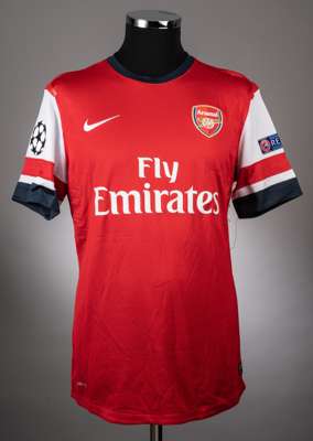 Mikel Arteta red Arsenal no.8 home jersey from the season 2012-13 Champions League campaign,
 Player issued short sleeved Nike example with the UEFA R