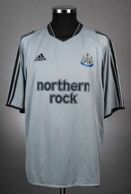 Lomana Lualua light blue No.20 Newcastle United short-sleeved jersey, 2003-04, 
 Adidas, XL, 3rd kit, with v-neck collar and printed badge, the revers