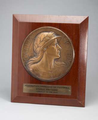 France Federation of Football bronze presentation plaque commemorating France v England match, played at Wembley Stadium, 26th May 1945, designed by A