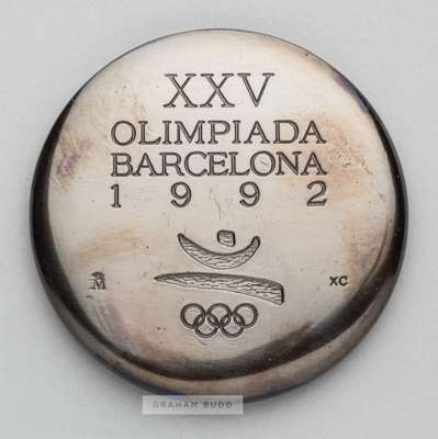 Barcelona 1992 Olympic Games participant's medal,
 designed by Xavier Corbero, copper, obverse depicting Olympic emblem and stylised jumping athlete, 
