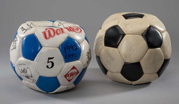 A black and white leather football bearing fourteen autographs of 1982 England World Cup squad, 
 including Steve Coppell, Kenny Sampson, Ray Clemence