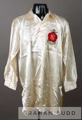 A trainer's unnumbered spare white Bolton Wanderers shirt for the 1953 "Stanley Matthews" FA Cup final,
 by Umbro, the unusual long-sleeved rayon mate