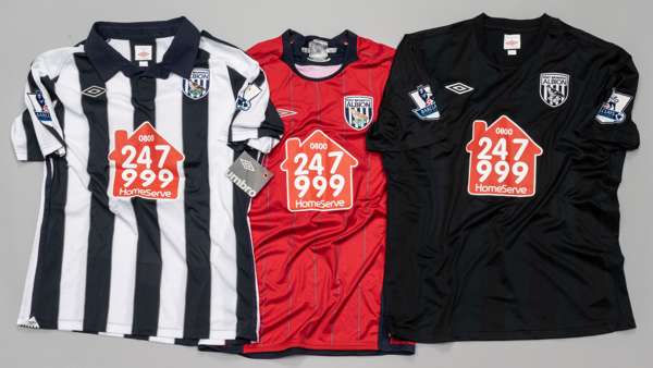 Three West Bromwich Albion jerseys,
 comprising Simon Cox red no.31 away jersey, season 2009-10, Umbro, short-sleeved with BARCLAYS PREMIER LEAGUE sle