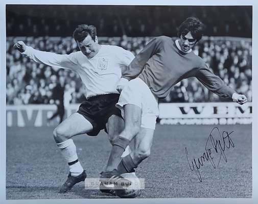 George Best signed portfolio postcard photograph,
 which shows Best wearing a Northampton Town FC tracksuit top after scoring six goals against them i