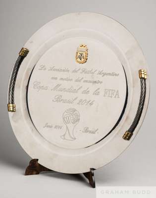 A white metal circular plate presented to Brazil