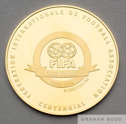 Pure gold FIFA centenary medal 1904-2004,
 stamped AU 999, obverse with FIFA emblem 100 Years and inscribed FEDERATION INTERNATIONALE DE FOOTBALL ASSO
