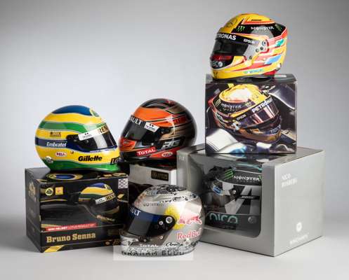 Collection of 14 1:2 scale replica F1 drivers helmets,
 in original boxes from different manufacturers, a signed Mika Hakkinen helmet and further unsi