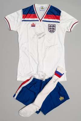 Kevin Reeves signed England home kit, season 1980-83,
 comprising white England no.15 jersey, Admiral, short-sleeved with national emblem badge and re