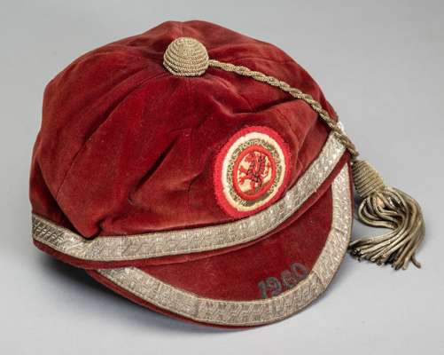 Two schools’ representative football caps, 

a Wales Schoolboy F.A. 1960, red velvet with gilt tassel and braiding, with WELSH SCHOOLS FOOTBALL ASSOCI