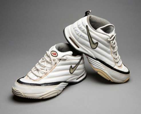 Signed tennis equipment, comprising: a pair of vintage white Nike Zm Air tennis shoes