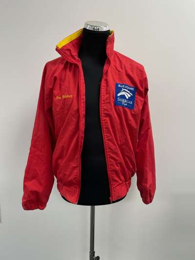 An autographed Pat Eddery European Team jacket issued for the Blue Square Shergar Cup,
 the red jacket with Virgin Atlantics sponsorship logo, signed 