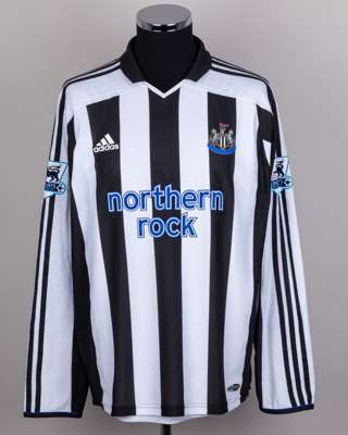 Shola Ameobi black and white No.23 Newcastle United v. Manchester United shirt, 2003-05