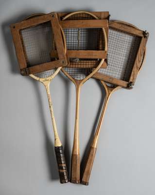 Three wooden badminton racquets, 
 comprising Wilson "Premier" wooden badminton racquet, double mains stringing, octagonal combed handle, length 66.5c
