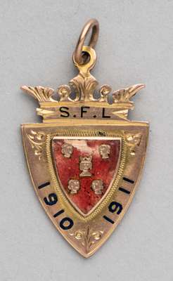 Southern Football League Division Two championship medal awarded to George Hancock of Reading FC in season 1910-11,
 9ct rose gold shield shaped medal