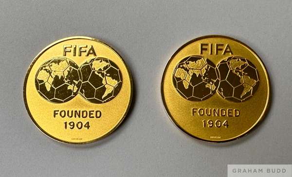 A pair of gold tone medallions presented to Pelé at an exhibition match between Italy and Argentina that took place in Zurich, Switzerland, on June 10