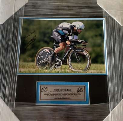 Mark Cavendish (UK) signed Tour De France 8 by 10in. action photograph,
 professionally framed / glazed with double mattes and plaque on Cavendish’s a
