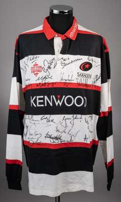 A black, white and red Saracens autographed rugby jersey, 
 Cotton Oxford, XXL, the front of the shirt bearing numerous player autographs