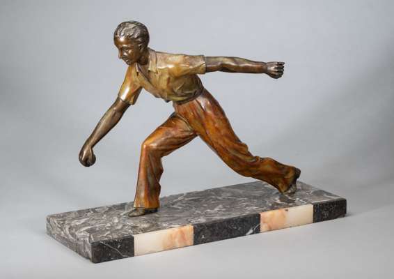 “Championat” sculpture cold painted figure of a male youth playing boules, circa 1930s,
 mounted on a marble base which is etched ‘Limousin’, length 4