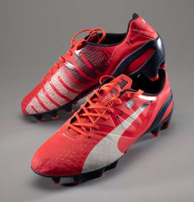 Pair of Sergio Ageuro football boots,
 pair of red Puma evoSpeed boots, numbered 16 to each inside heel, bearing Argentina national flag and inscribed