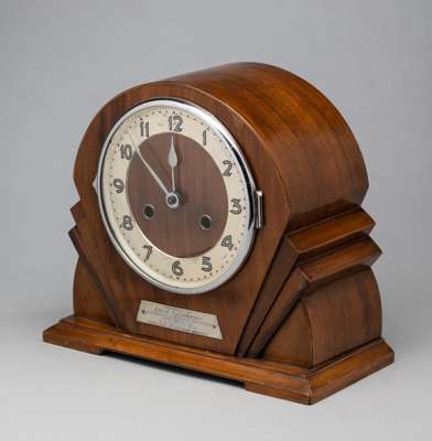 An Art Deco wooden cased mantel clock presented to the Arsenal footballer Jack Lambert, 
 set with a plaque reading PRESENTED TO JACK LAMBERT IN APPRE