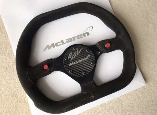Bruno Senna McLaren 570s GT4 signed steering wheel,  

After McLaren re-entered the supercar market in 2011 with the MP4/12c, it was only a matter of 