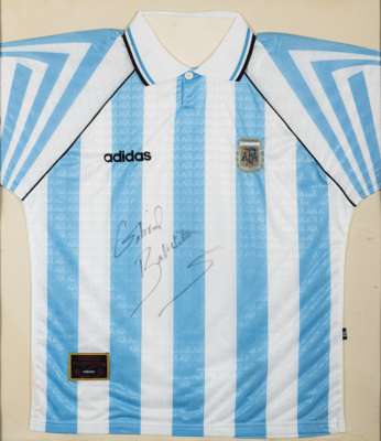 Gabriel Batistuta autographed Argentina blue and white replica short-sleeved jersey, 
 Adidas with button-up collar and embroidered badge, framed and 