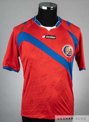 A red Costa Rica replica jersey signed by the 2014 World Cup squad