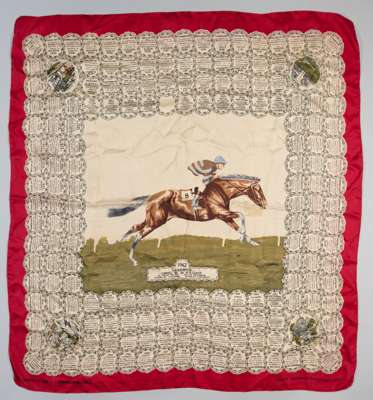 A ladies silk scarf commemorating the victory of Mr Guest's Larkspur in the 1962 Derby,
 featuring horse and jockey in central image above cartouche w