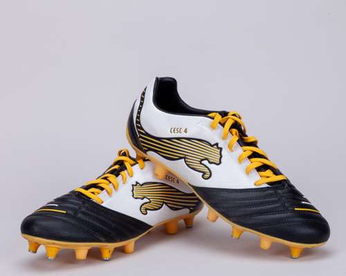 Cesc Fabregas a pair of black, white and yellow Puma football boots