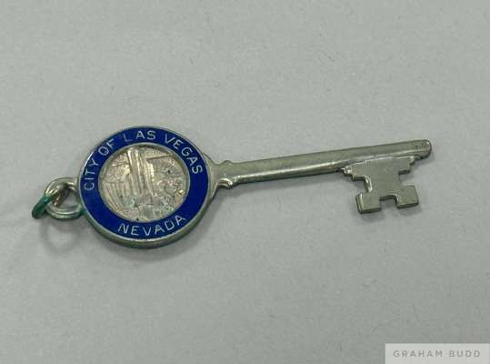 A framed "Honorary Citizen Award," and gold tone "Key To The City," presented to Pelé on April 8, 1977, by the city of Las Vegas, Nevada. 
 Pelé's New