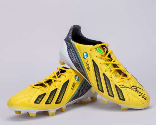 Lionel Messi a pair of yellow Adidas Adizero f50 autographed football boots