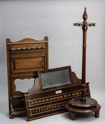 A fine collection of Victorian antique billiard furniture from the late 19th century including an original Thurstons score board, revolving cue stand 