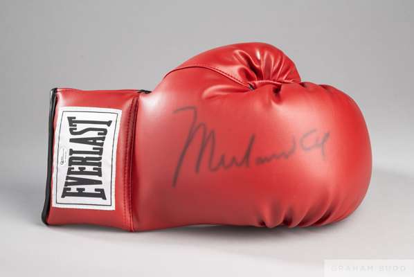 A Muhammad Ali autographed 10oz Everlast boxing glove
 authenticated by Online Authentics.com, OA-8309380, signature slightly faded