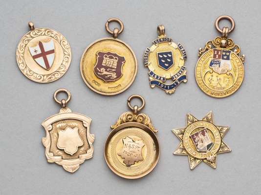 A miscellany of seven gold football medals,
 all in 9ct gold, four enamelled, all bearing inscriptions, including Western Football League, Sussex Seni