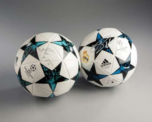Lionel Messi and Cristiano Ronaldo signed footballs, both Adidas UEFA Champions League Capitano match ball replicas, both signatures in silver marker 