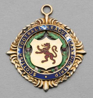 Scottish Football League first Division Championship medal won by Celtic player in season 1967-68,
 9ct gold & enamel, weight 9gms., inscribed with co