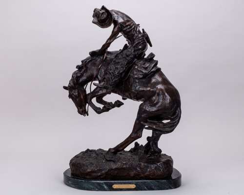 After Frederic Remington's American 19th century equestrian sculpture “Rattlesnake”