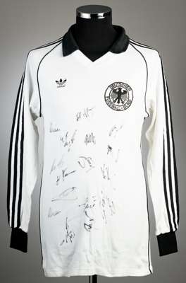 A team-signed white West Germany No.15 jersey circa 1982,
 Adidas, long-sleeved, with national emblem, size L, signed in black marker pen on the front
